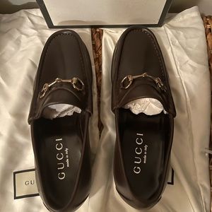 Mens Gucci dark brown leather loafers . Never worn  and still in box and shoe.